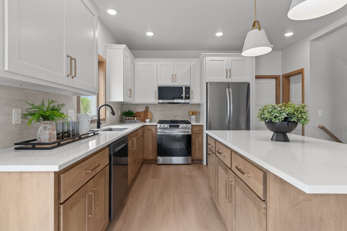 Custom kitchen by Midwest Design Homes featuring gas range and clean modern design in Fox Cities, WI