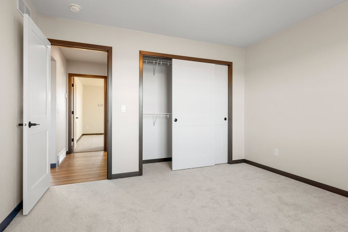 Empty bedroom with closet in a Midwest Design Homes custom home in Kaukauna, WI