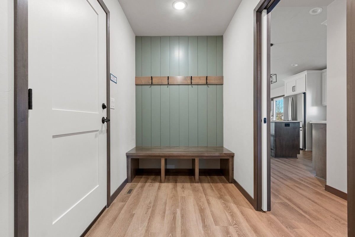 Entryway mudroom with bench and hooks in a Midwest Design Homes custom home in Kaukauna, WI