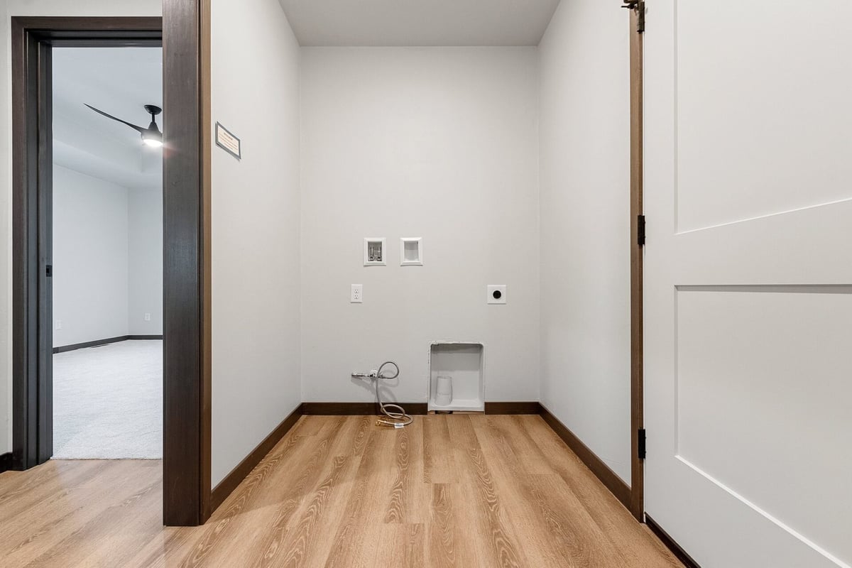 Laundry room with washer and dryer hookups in a Midwest Design Homes custom home in Kaukauna, WI