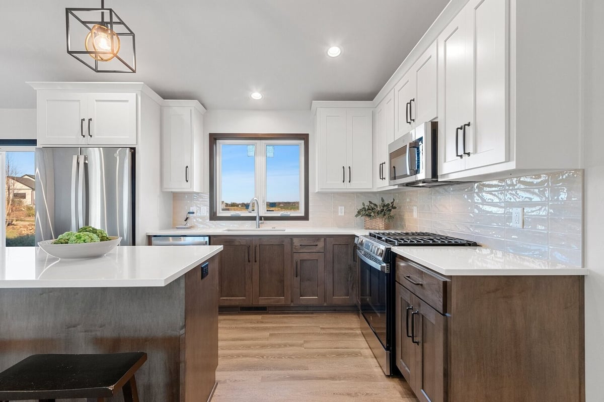 Modern custom home kitchen with stainless steel appliances by Midwest Design Homes in Appleton, WI