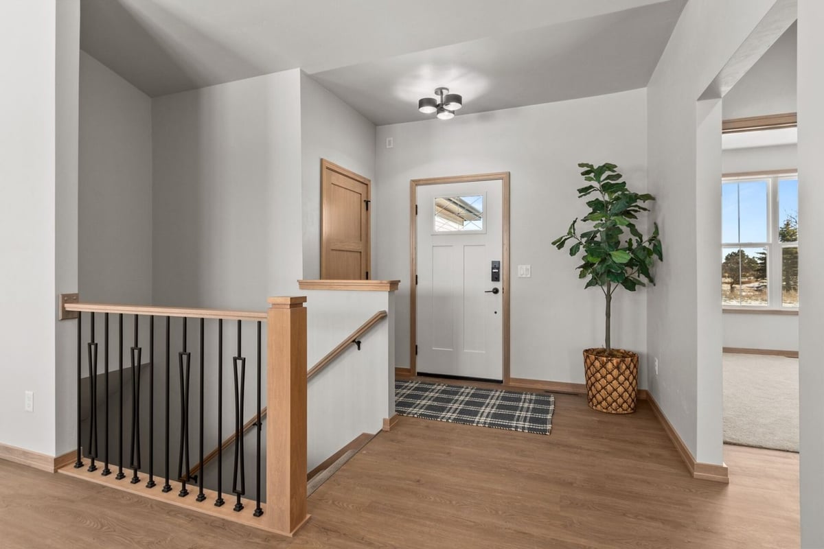 Bright entry hall design with hardwood flooring built by Midwest Design Homes in Greenville, WI