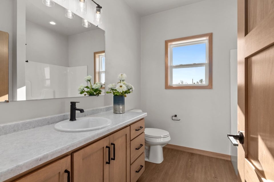 Custom home bathroom with modern vanity built by Midwest Design Homes in Ledgeview, WI