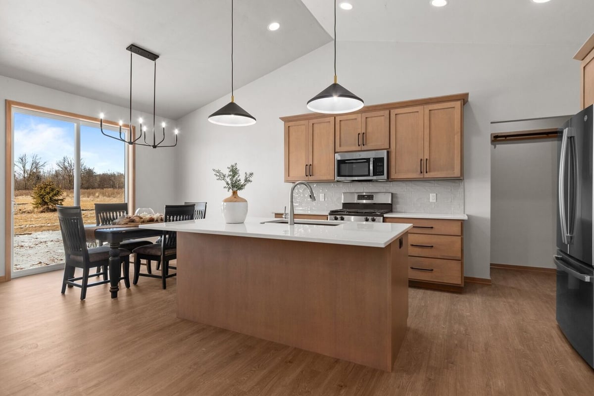 Custom kitchen with large island by Midwest Design Homes in Fremont, WI