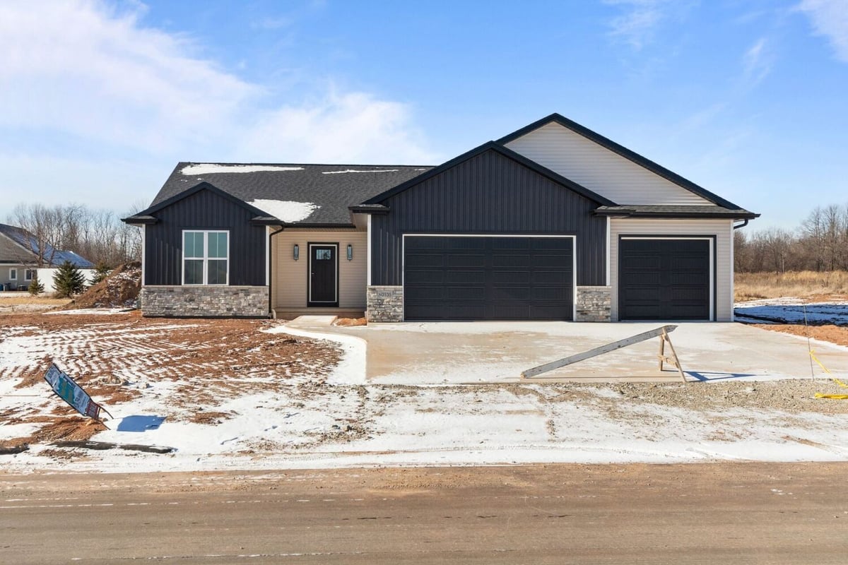 Front view of a new ranch home with stone accents by Midwest Design Homes in Appleton, WI