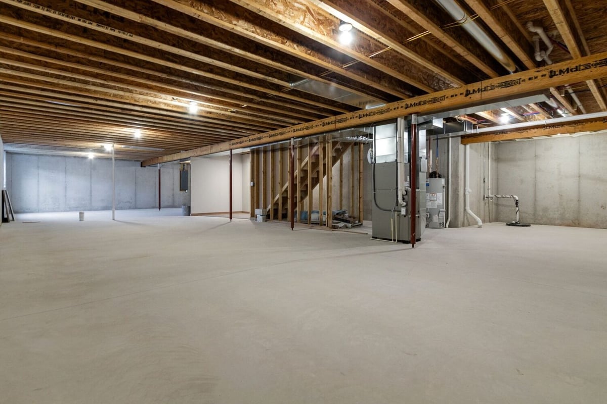 Large unfinished basement with utilities by Midwest Design Homes in Kaukauna, WI