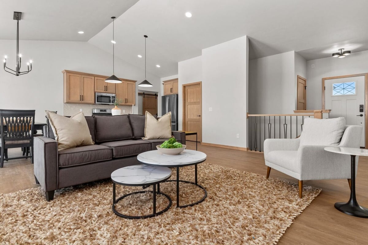 Modern living area with vaulted ceilings designed by Midwest Design Homes in Bellevue, WI