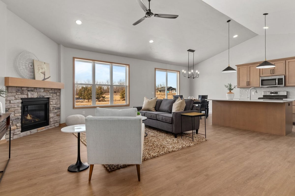 Open-concept living room and kitchen in a Midwest Design Homes custom home in De Pere, WI