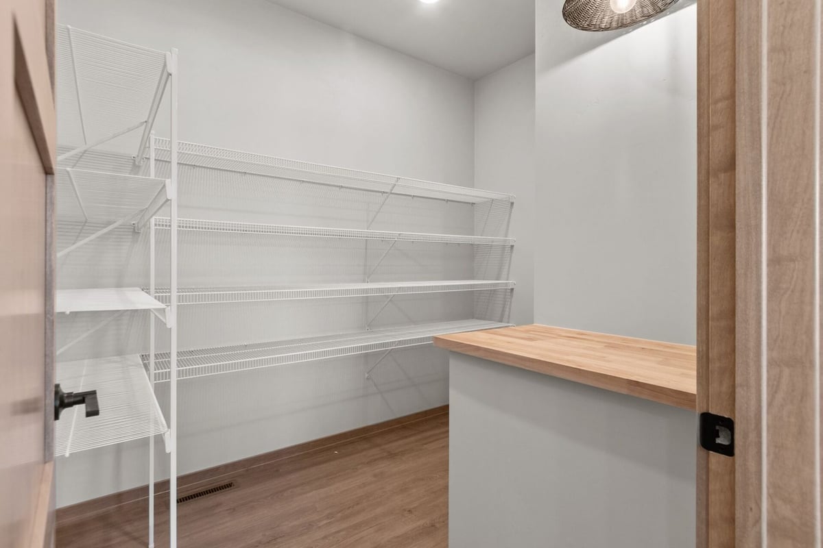 Organized walk-in pantry design built by Midwest Design Homes in Fremont, WI
