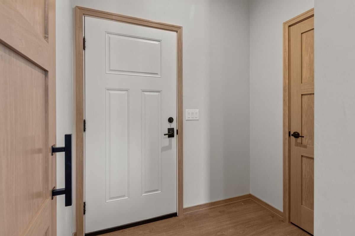 Side entry with white door in a Midwest Design Homes custom home in Appleton, WI