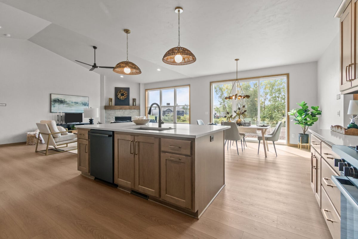 Custom home kitchen and dining space with large windows by Midwest Design Homes in Ledgeview, WI
