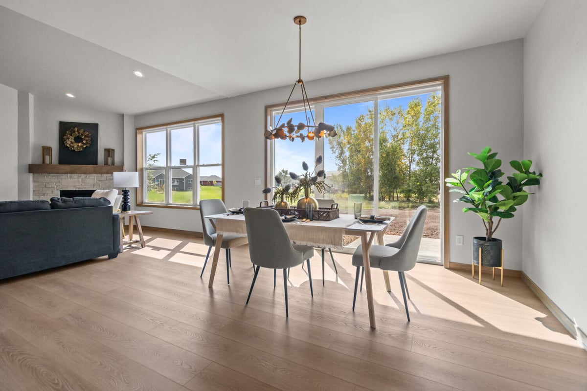 Dining area with large windows in a custom home by Midwest Design Homes in Harrison, WI