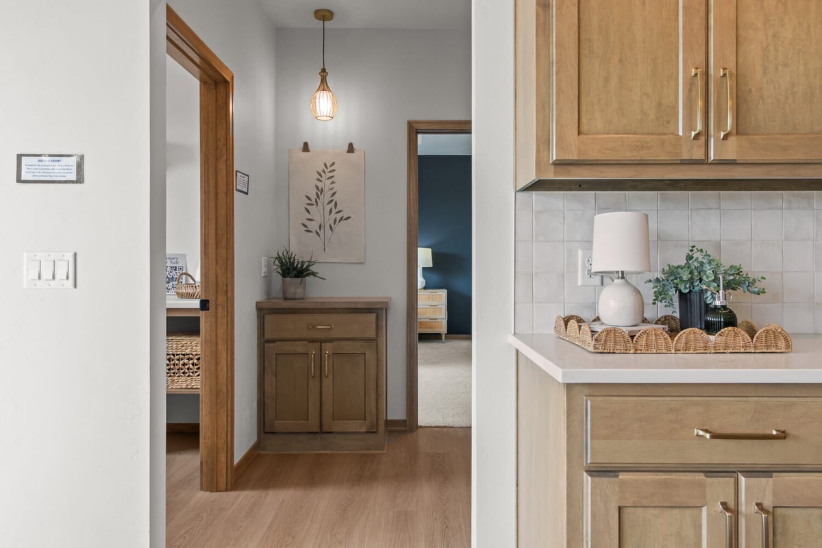 Hallway view into custom home kitchen by Midwest Design Homes in the Fox Cities, WI