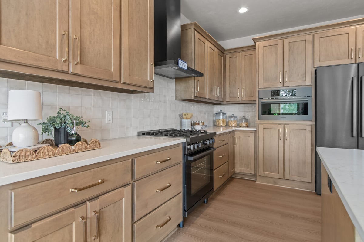 Modern kitchen design with tile backsplash by Midwest Design Homes in Appleton, WI