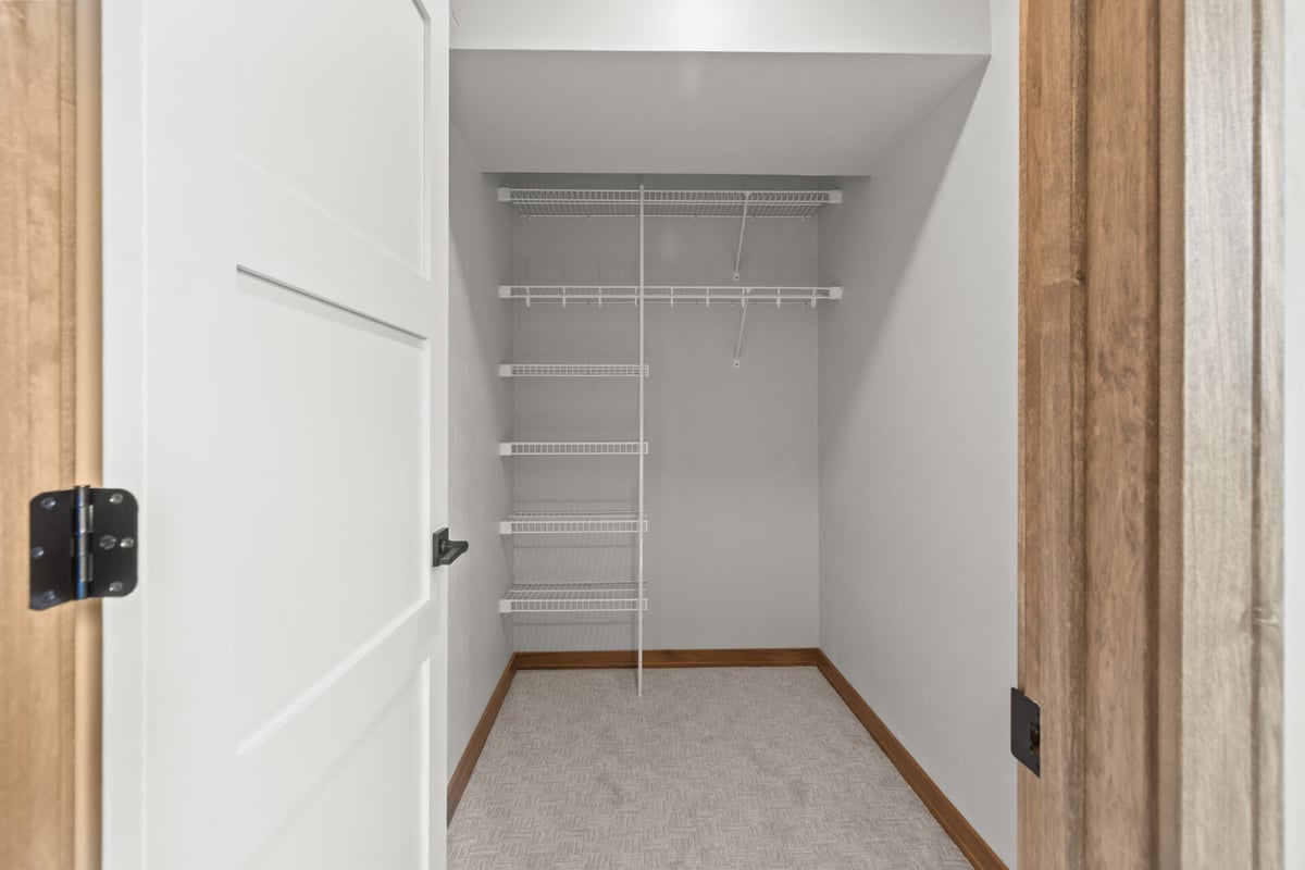 Small closet with wire shelving in a custom home by Midwest Design Homes in Green Bay, WI