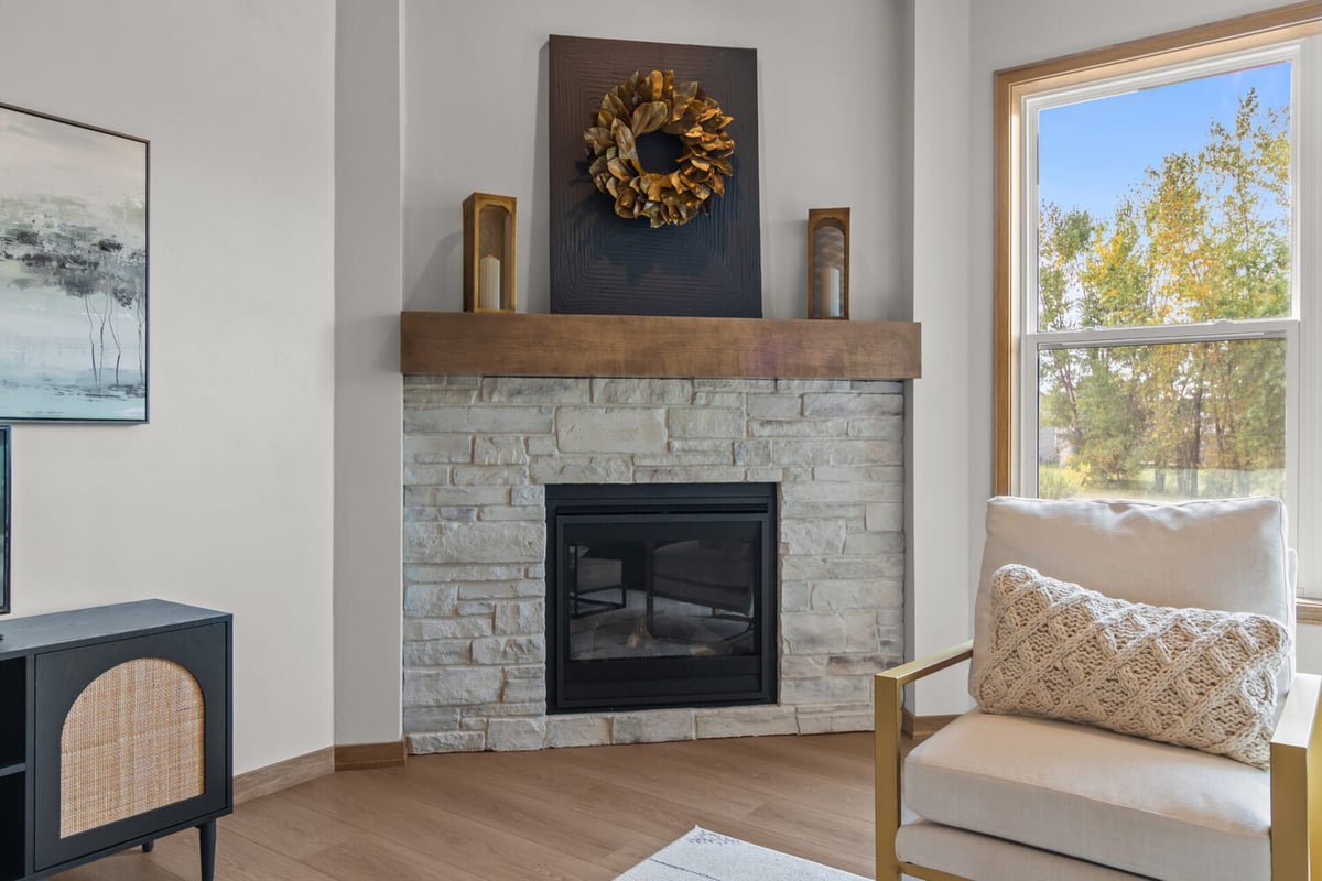 Stone fireplace feature in custom living room by Midwest Design Homes in Harrison, WI