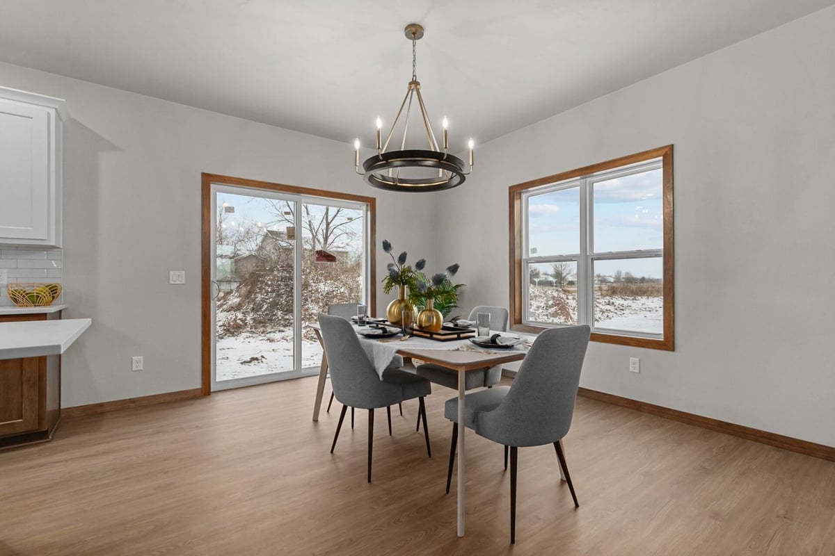 Custom dining room with large windows in a Green Bay, WI home by Midwest Design Homes