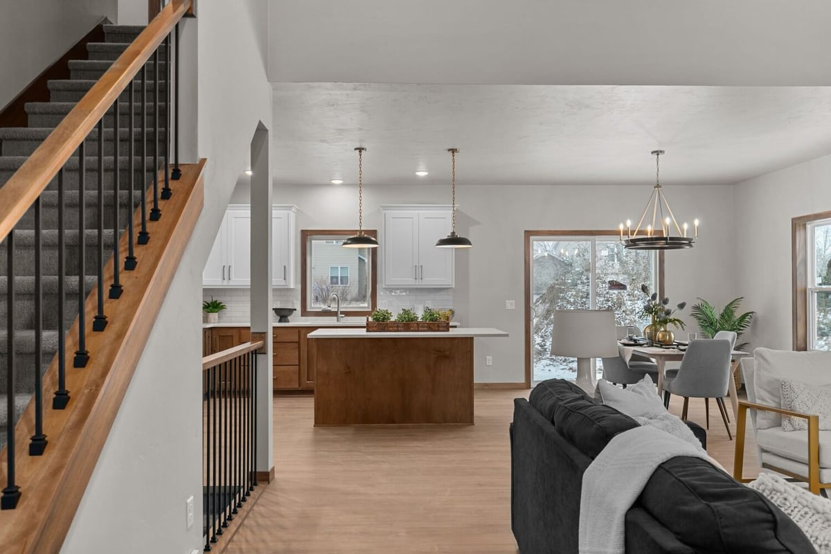 Custom open-plan living space with island kitchen in Fox Cities, WI by Midwest Design Homes