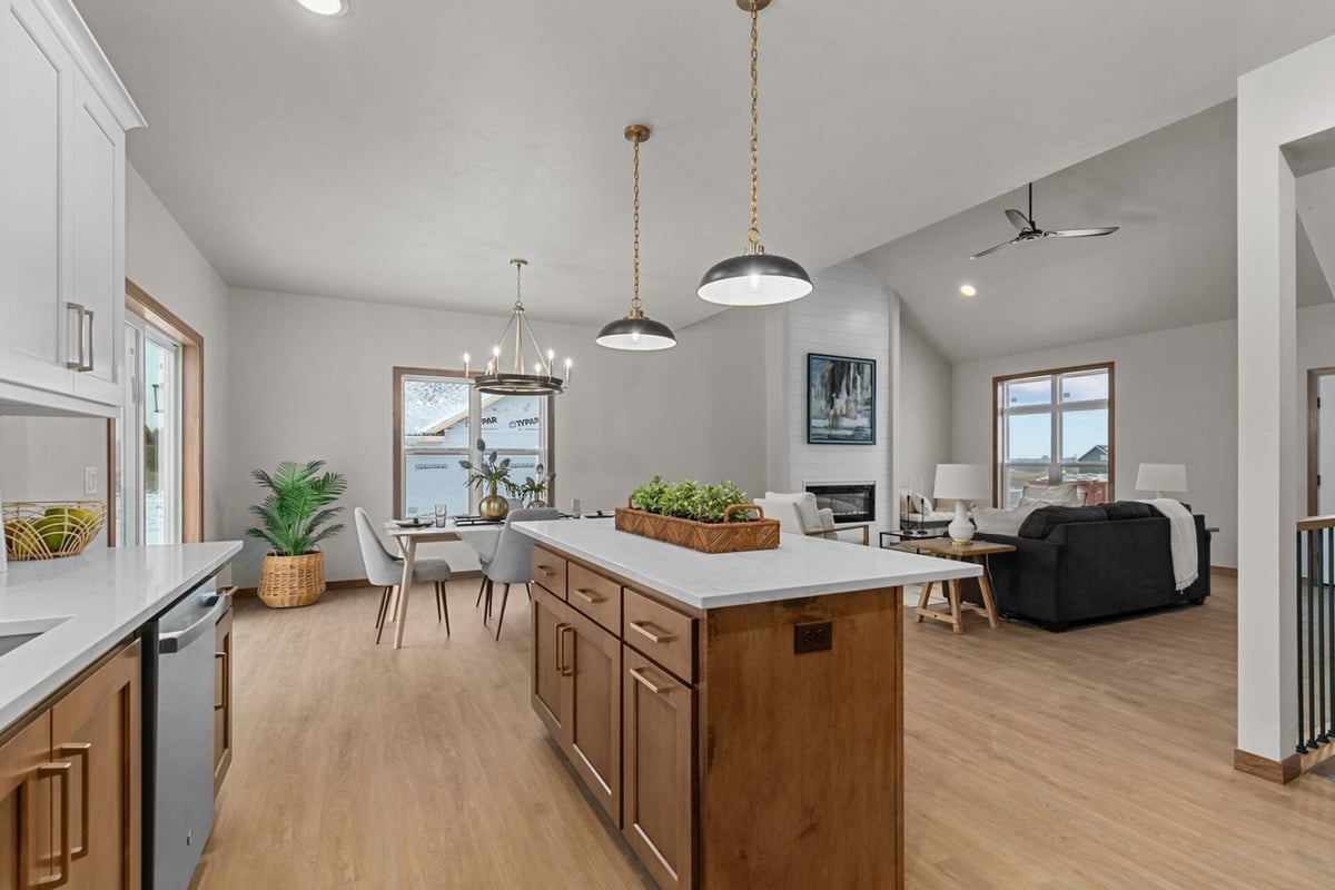Kitchen and dining area flowing into living space in a custom home by Midwest Design Homes in Harrison, WI