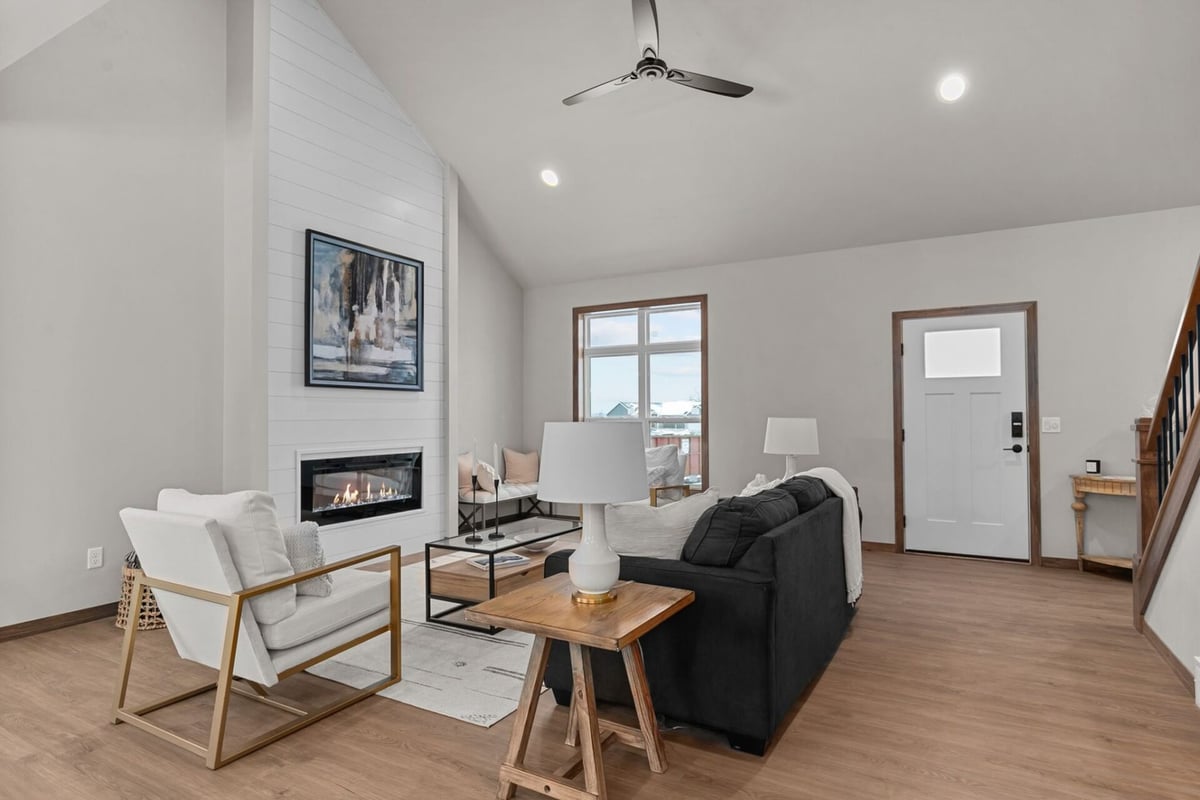 Living room with shiplap fireplace in a custom home by Midwest Design Homes in the Fox Cities, WI