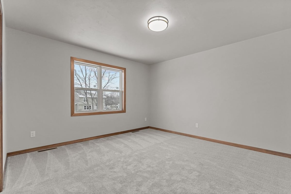 Simple and bright bedroom layout in a Wisconsin custom build by Midwest Design Homes