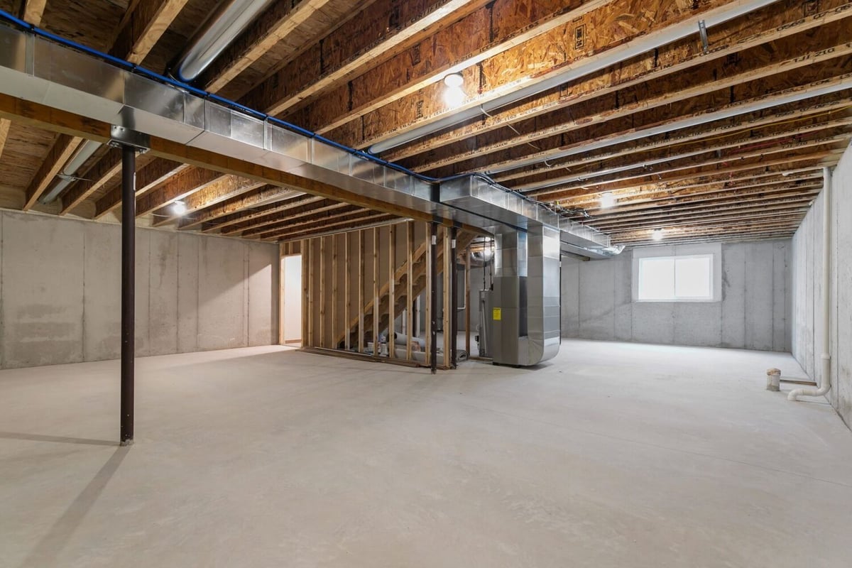 Spacious unfinished basement in a Wisconsin new build by Midwest Design Homes