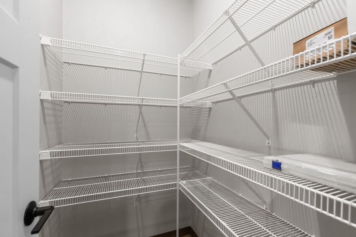 Walk-in pantry with ample storage space in a Fox Cities, WI custom home by Midwest Design Homes