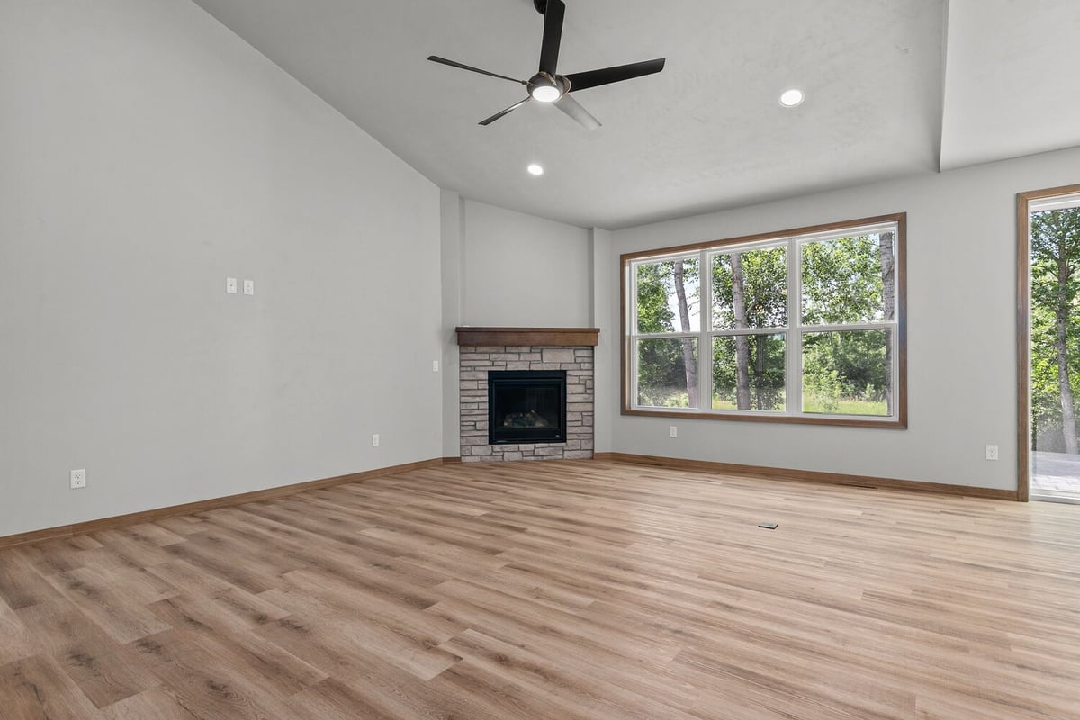 Fireplace and windows in Harrison living room by Midwest Design Homes, custom build