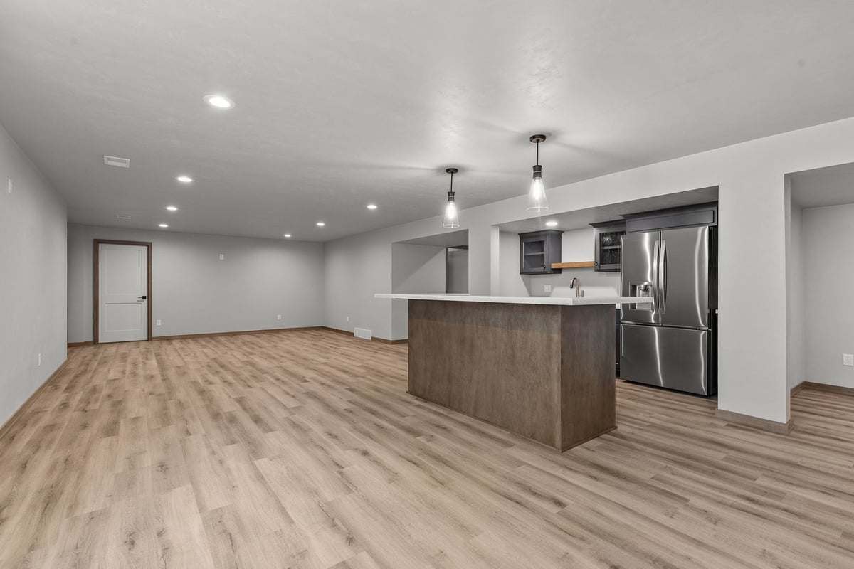 Open basement bar area in Wisconsin custom build by Midwest Design Homes