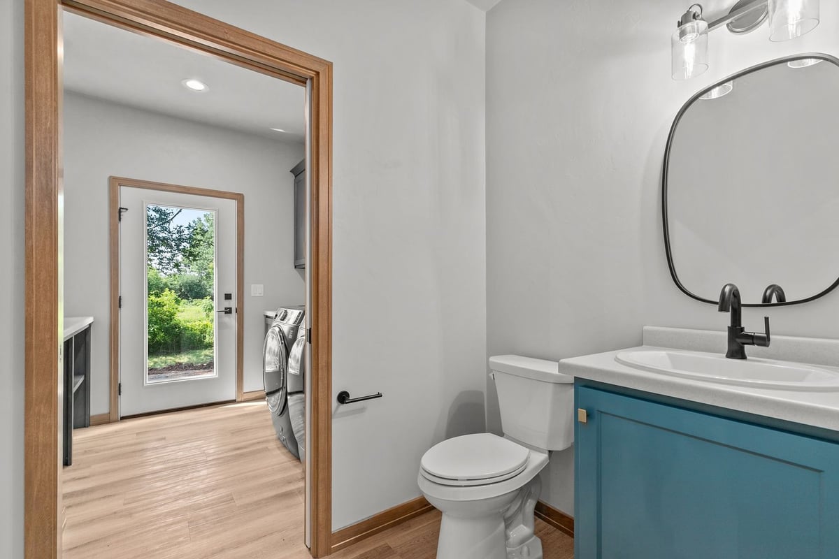 Powder room and laundry area in custom home by Midwest Design Homes in Fox Cities, WI