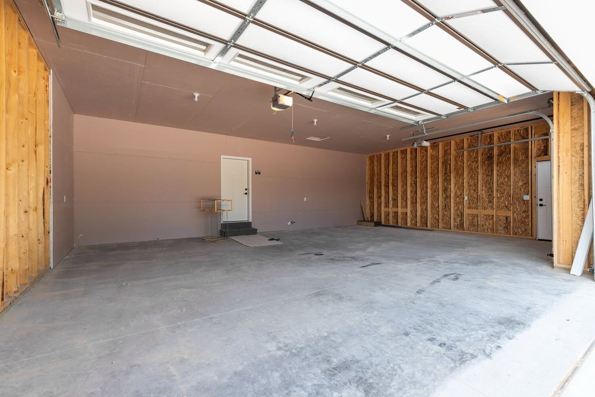 Spacious garage under construction in Wisconsin custom home by Midwest Design Homes