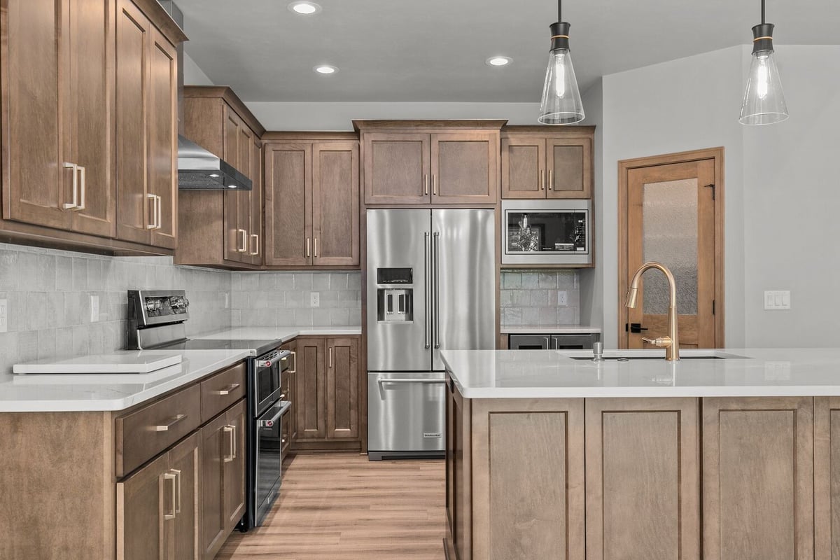 Stainless steel fridge in custom kitchen by Midwest Design Homes in Appleton, WI