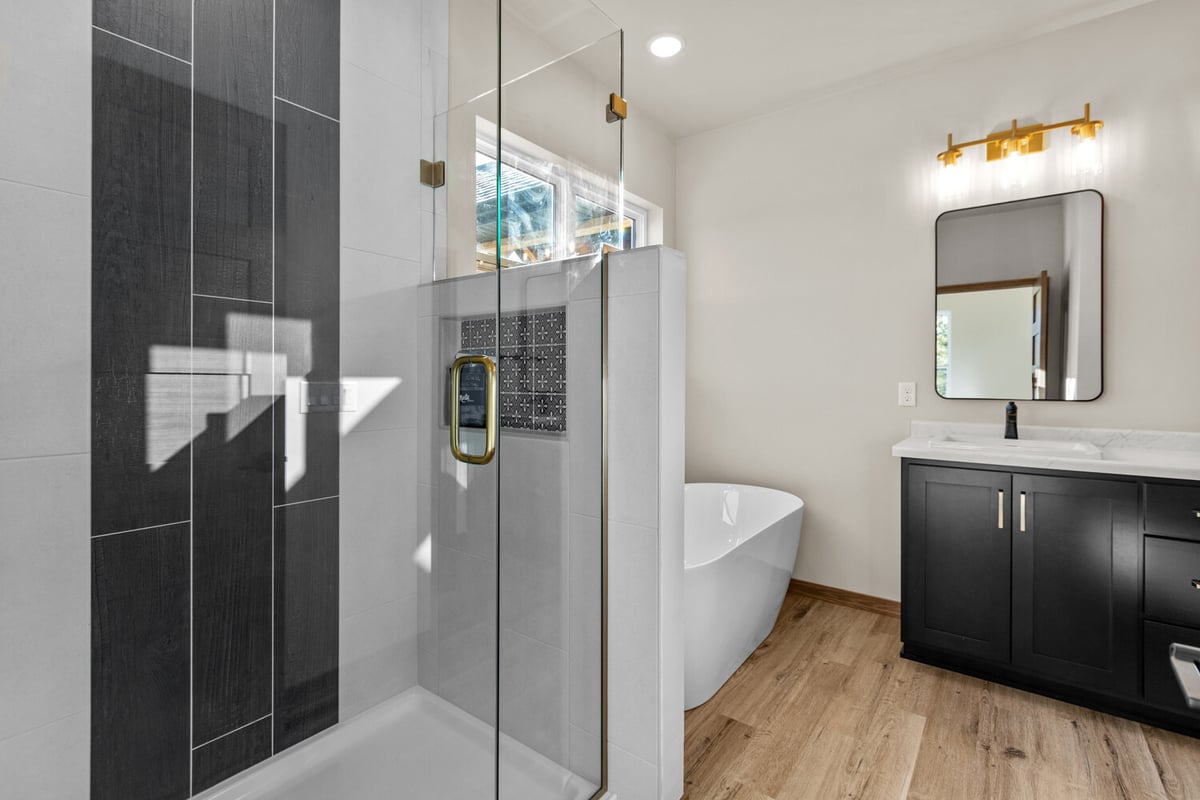 Custom walk-in shower with soaking tub in Kaukauna home by Midwest Design Homes.