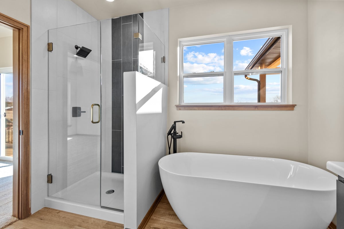 Freestanding tub and shower in custom Kaukauna home by Midwest Design Homes