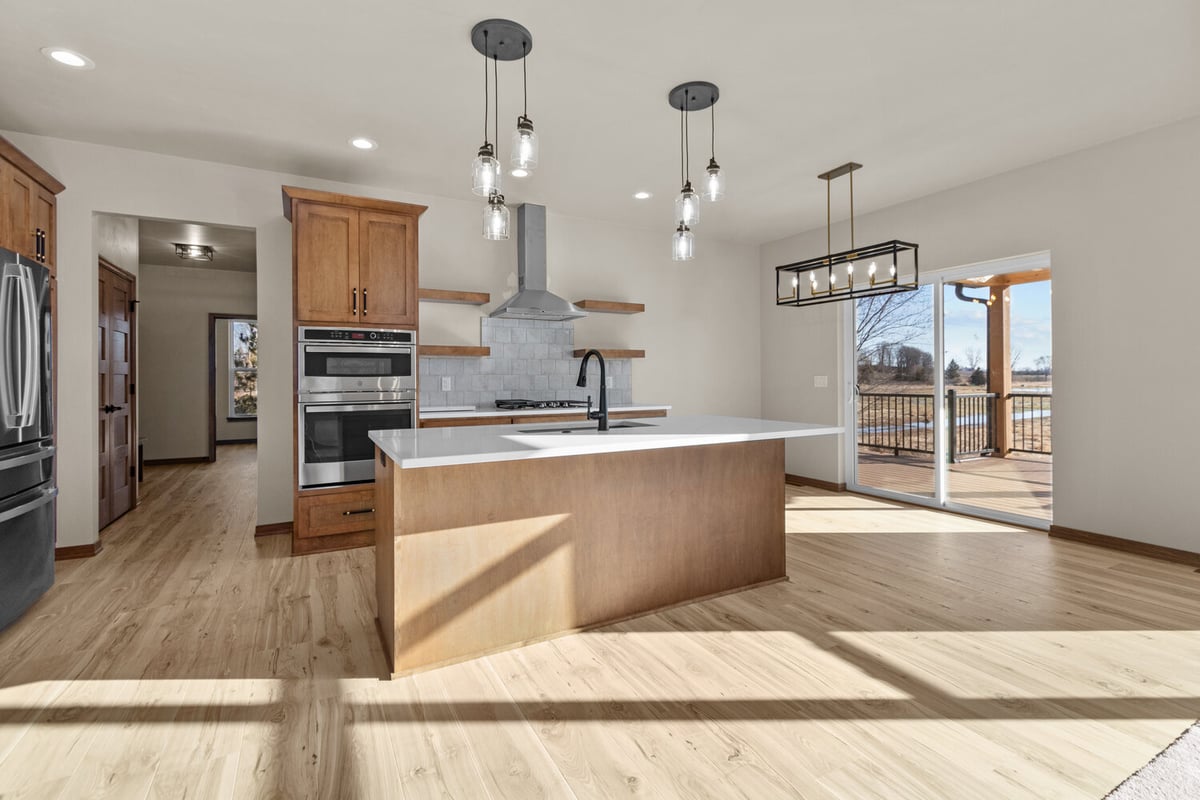 Modern kitchen design with open shelving in De Pere, WI custom home
