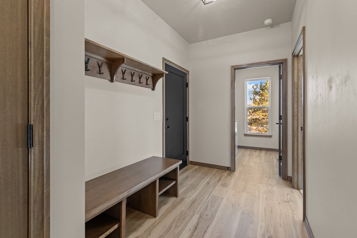 Mudroom bench and hooks in custom home near Kaukauna, WI by Midwest Design Homes