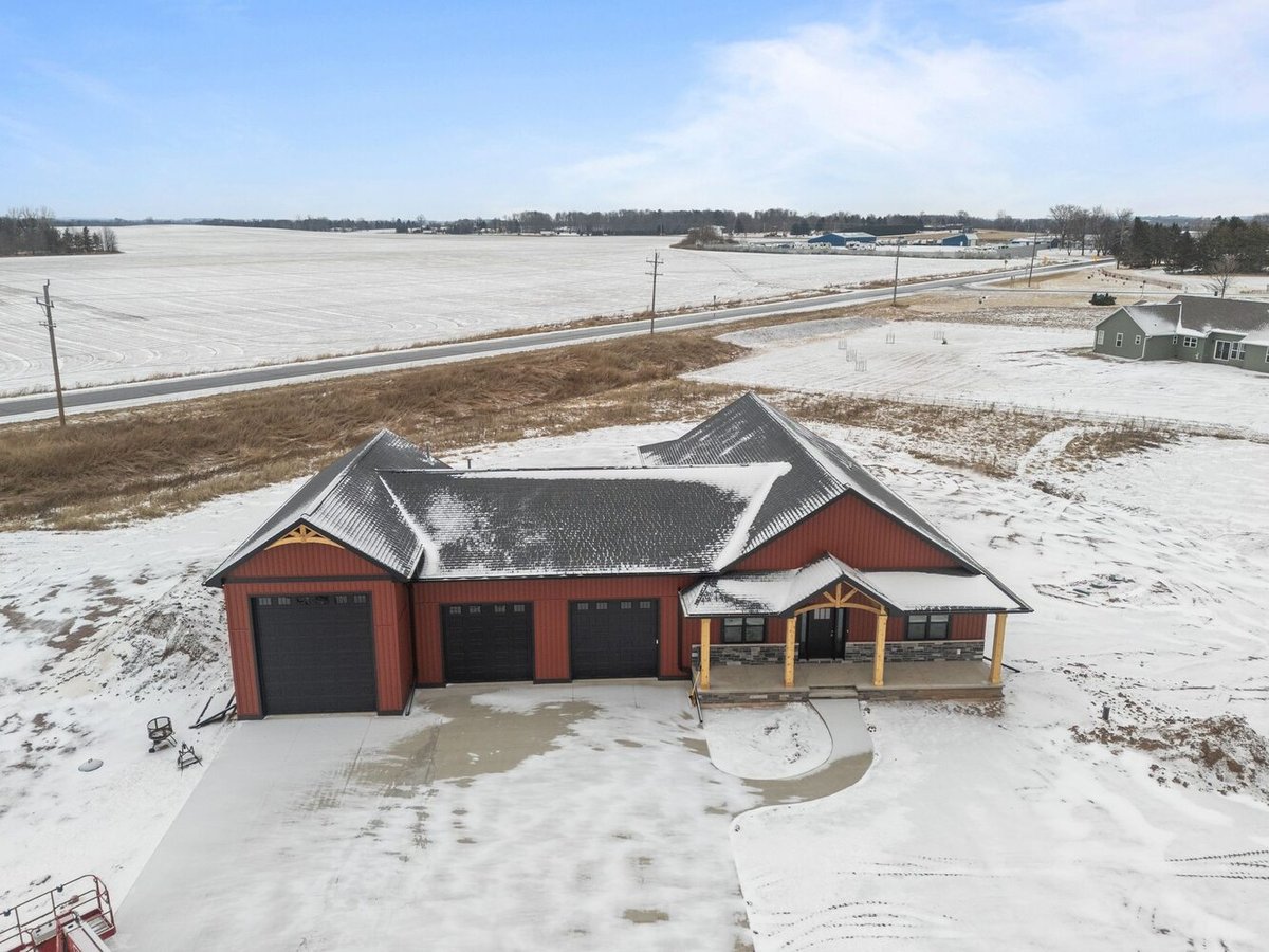 Front view of custom-built home in Wisconsin by Midwest Design Homes in winter