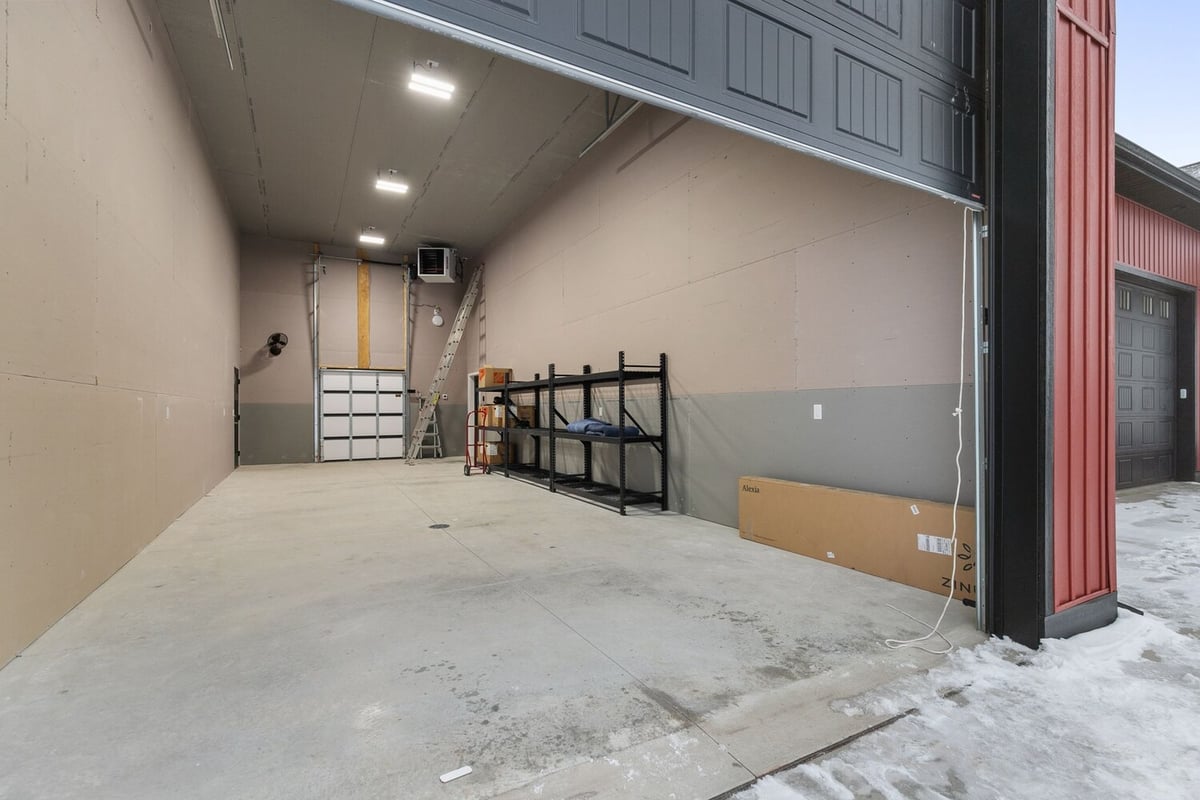 Interior garage space in custom Kaukauna, WI home by Midwest Design Homes