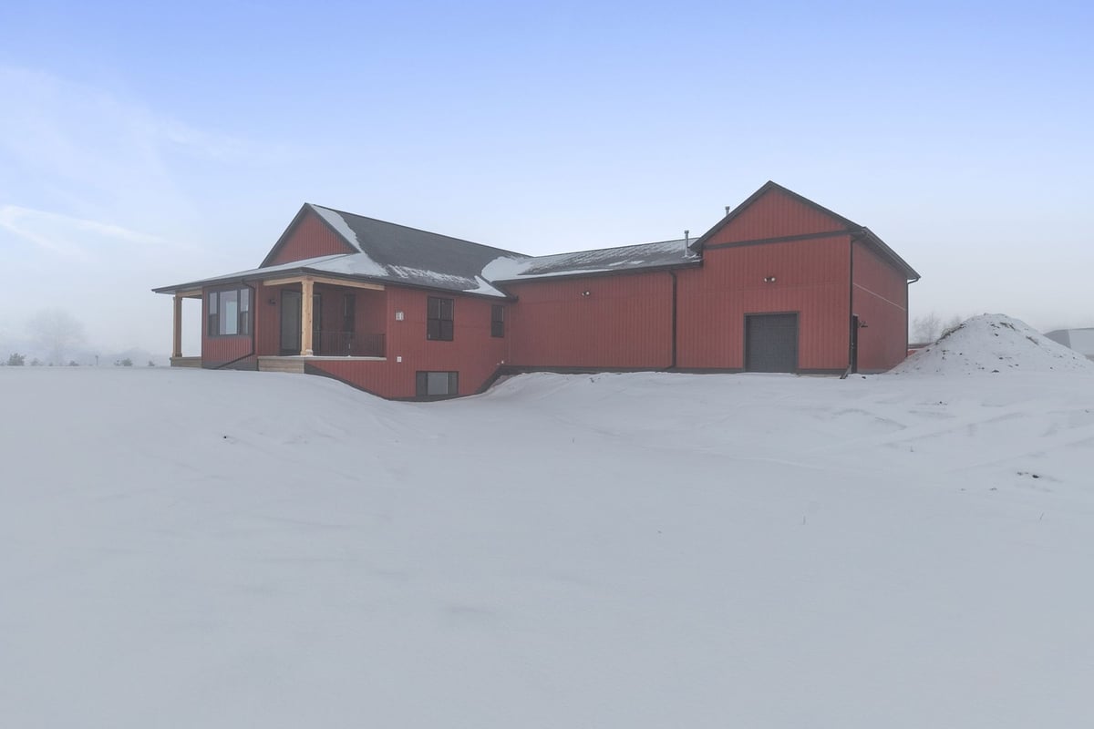 Snow-covered back exterior of Midwest Design Homes build in Kaukauna, WI