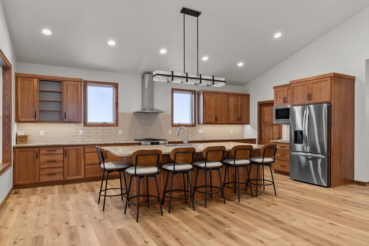 Spacious kitchen with island seating in Kaukauna, WI home by Midwest Design Homes