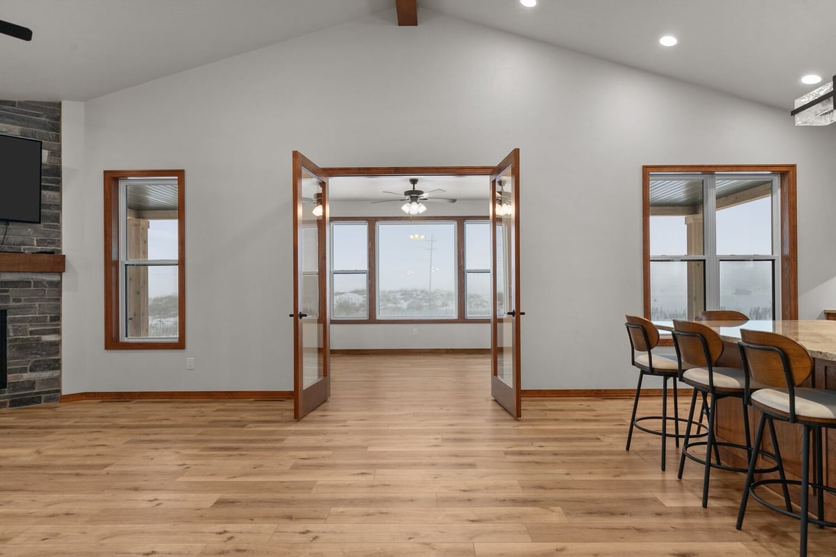 Sunroom entrance with wood trim in Wisconsin custom home by Midwest Design Homes