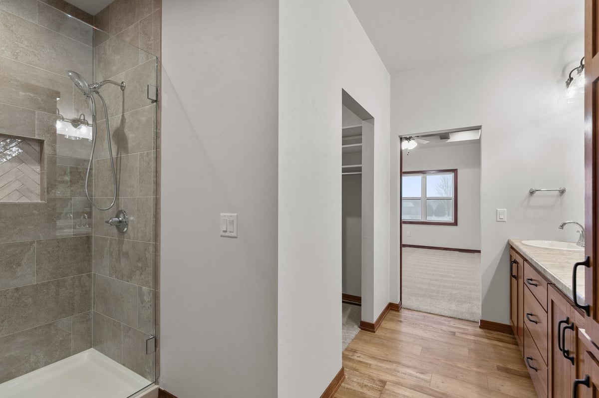 Walk-in tiled shower and vanity in Kaukauna custom home by Midwest Design Homes, WI