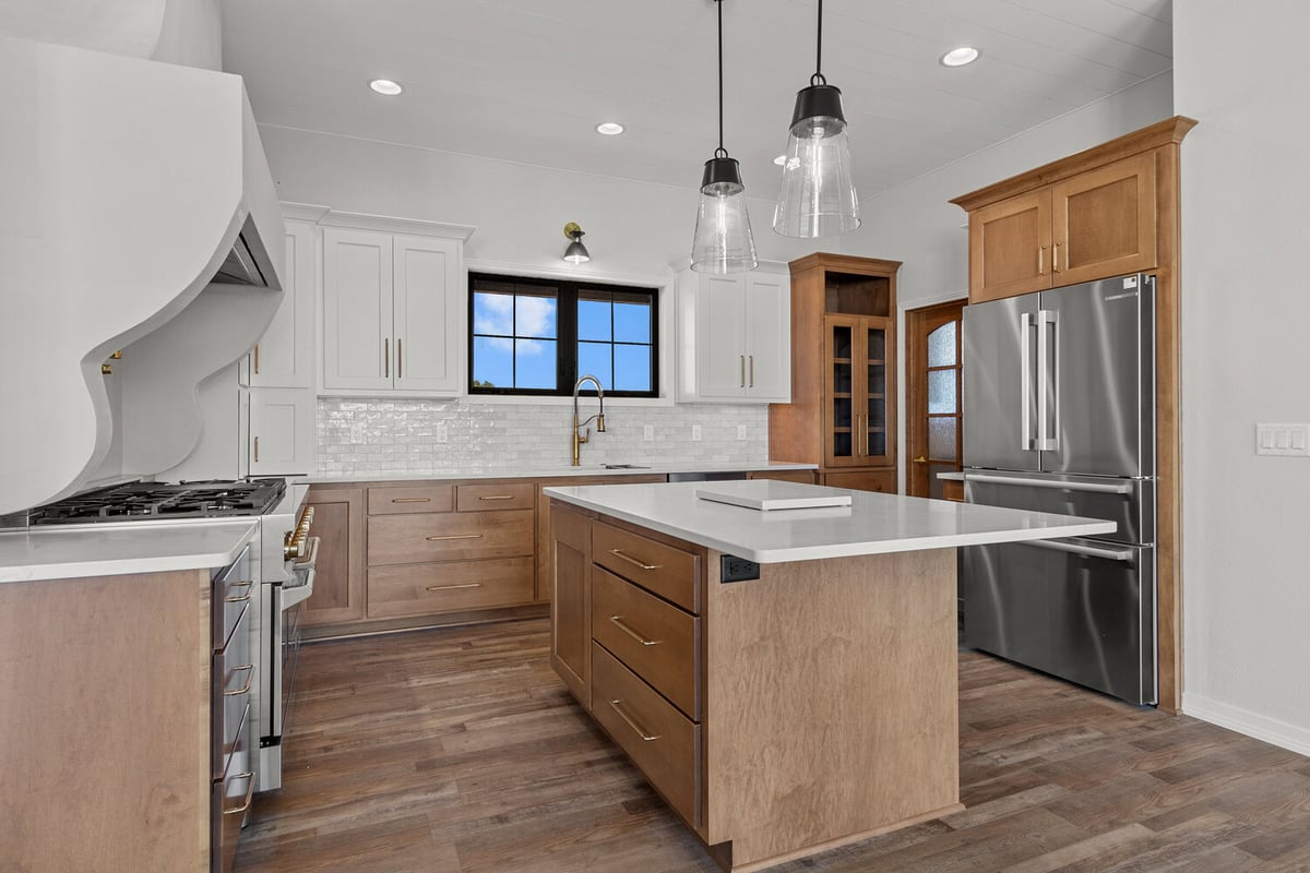 Custom kitchen island and modern appliances by Midwest Design Homes in Bellevue Wisconsin