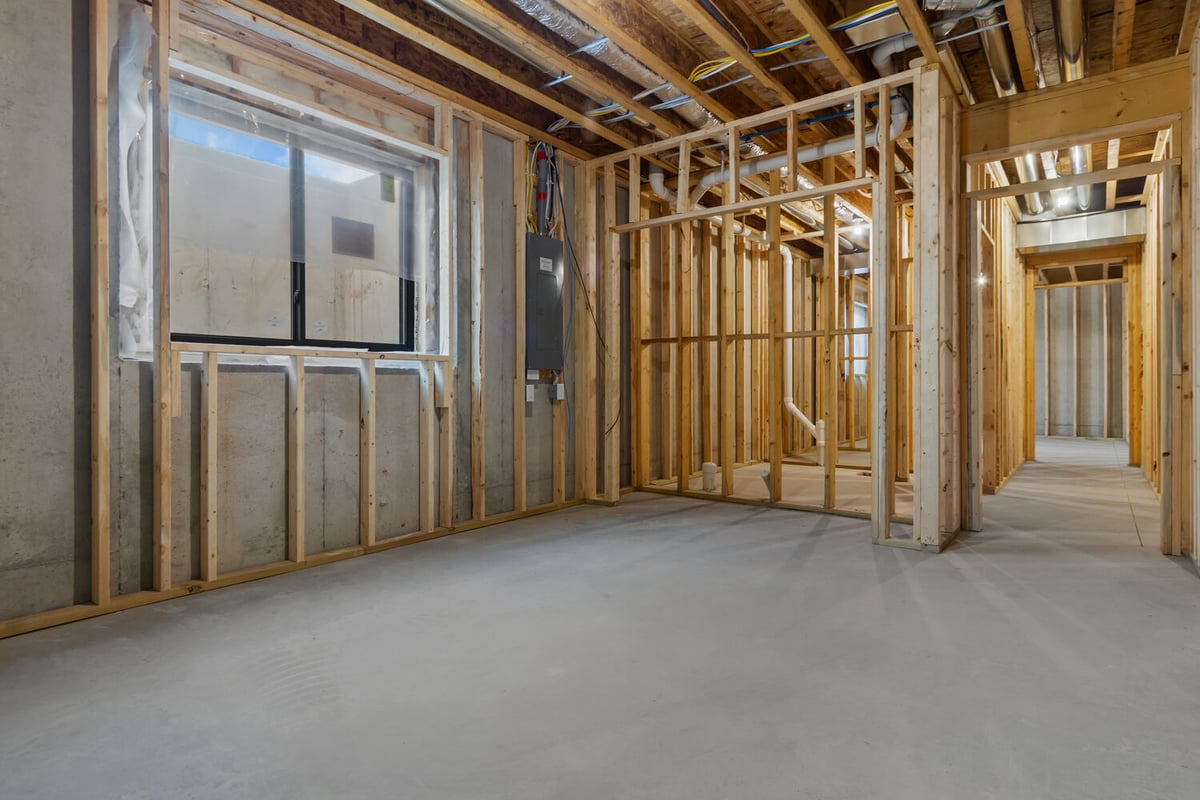 Framed basement with egress window by Midwest Design Homes in Fox Cities, Wisconsin