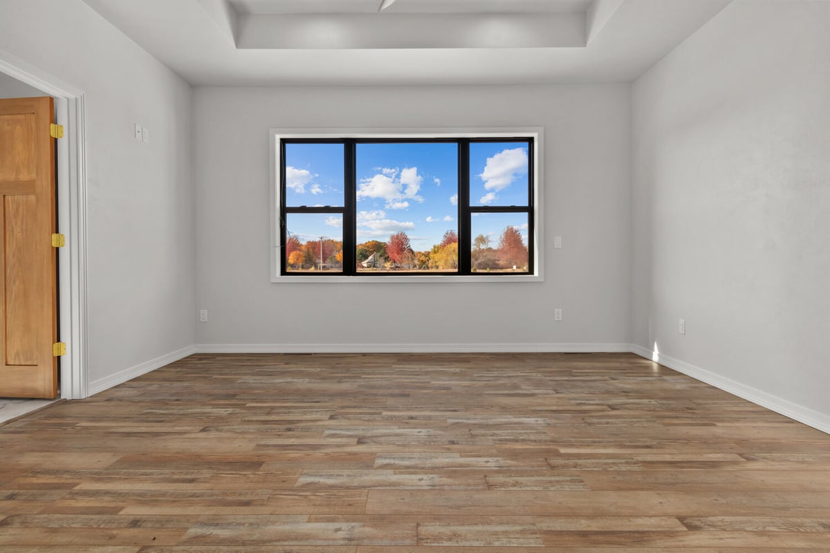 Master bedroom with tray ceiling by Midwest Design Homes in Neenah, Wisconsin
