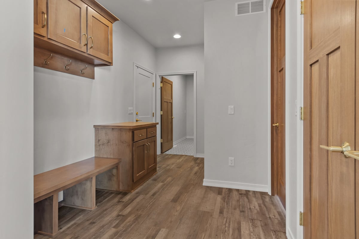 Mudroom with storage bench in custom home by Midwest Design Homes in Kaukauna, WI