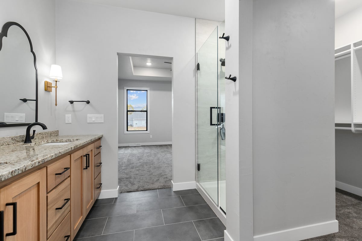 Bathroom with shower and vanity view in custom home by Midwest Design Homes in Green Bay WI