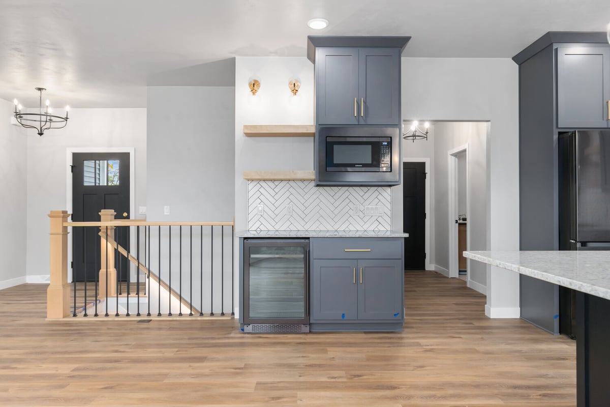 Built-in beverage fridge and upper cabinets in Kaukauna home by Midwest Design Homes