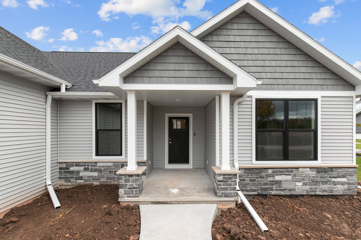 Covered front entry of new custom home by Midwest Design Homes in Kaukauna Wisconsin