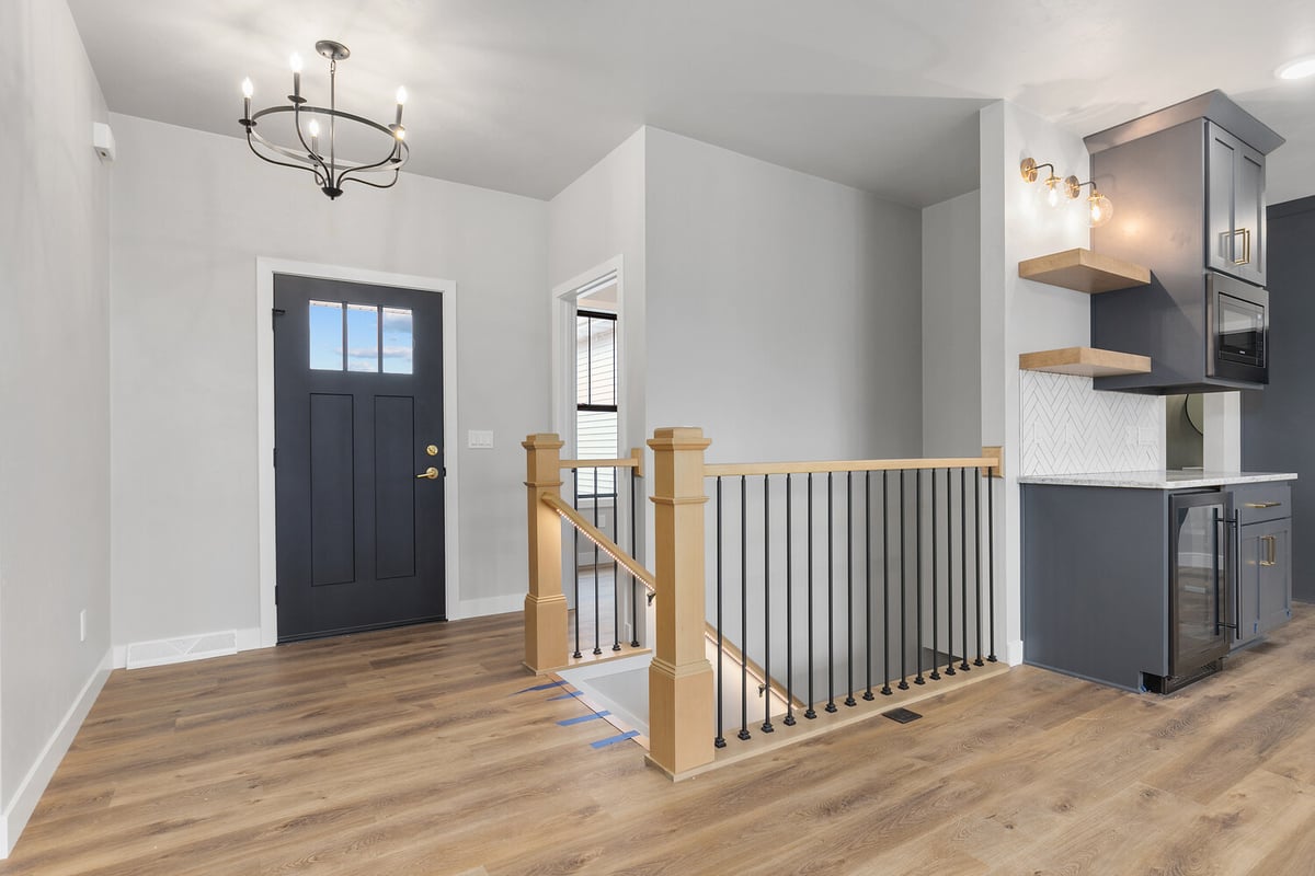 Custom home entry and stair railing design by Midwest Design Homes in Kaukauna, WI